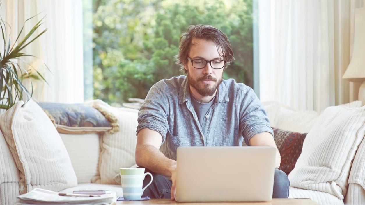 Professional developer reviewing code and design specifications on dual monitors